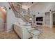 Elegant living room with high ceilings, fireplace, staircase, and modern decor at 14809 Ninebark Ct, Land O Lakes, FL 34638