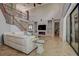 Spacious living room featuring soaring ceilings, fireplace, staircase and sliding glass doors at 14809 Ninebark Ct, Land O Lakes, FL 34638