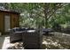 Cozy patio features comfortable outdoor seating and shady trees, perfect for relaxing at 14809 Ninebark Ct, Land O Lakes, FL 34638