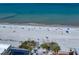 Stunning aerial shot capturing the pristine sandy beach and clear turquoise ocean waters at 1500 Gulf Blvd # 103B, Indian Rocks Beach, FL 33785