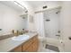 Well-lit bathroom with a shower-tub combo, neutral-toned vanity, and modern fixtures at 1500 Gulf Blvd # 103B, Indian Rocks Beach, FL 33785