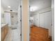 Bathroom and bunkroom view, featuring a shower with curtain, sink, and convenient access from the bedroom at 1500 Gulf Blvd # 103B, Indian Rocks Beach, FL 33785