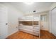 This bedroom offers cozy bunk beds, perfect for accommodating guests or Gathering members at 1500 Gulf Blvd # 103B, Indian Rocks Beach, FL 33785