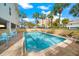 Inviting community pool surrounded by lounge chairs, perfect for relaxation and enjoying sunny days at 1500 Gulf Blvd # 103B, Indian Rocks Beach, FL 33785