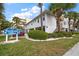 Charming Beachside Villas exterior with lush landscaping and convenient parking at 1500 Gulf Blvd # 103B, Indian Rocks Beach, FL 33785