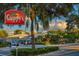 Guppy's On The Beach restaurant view featuring lush greenery, ample parking, and a welcoming facade at 1500 Gulf Blvd # 103B, Indian Rocks Beach, FL 33785