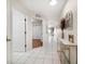 Long hallway with tiled floors and views into other rooms at 1500 Gulf Blvd # 103B, Indian Rocks Beach, FL 33785