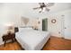 Main bedroom features a comfortable king bed, ensuite bathroom and ceiling fan at 1500 Gulf Blvd # 103B, Indian Rocks Beach, FL 33785