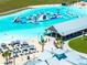 Aerial view of the lagoon community showcasing outdoor lounging, dining, and recreation for residents at 16810 Trite Bend St, Wimauma, FL 33598