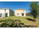 Large backyard with a lush lawn, providing ample space for outdoor activities and relaxation at 16810 Trite Bend St, Wimauma, FL 33598
