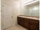 Bathroom with double sinks, granite countertops, and shower at 16810 Trite Bend St, Wimauma, FL 33598