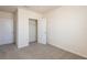 Neutral carpeted bedroom with closet and doorway at 16810 Trite Bend St, Wimauma, FL 33598