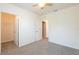Bedroom featuring walk-in closets, ceiling fan, and adjoining room at 16810 Trite Bend St, Wimauma, FL 33598