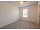 Bedroom featuring carpet, ceiling fan, and a window at 16810 Trite Bend St, Wimauma, FL 33598