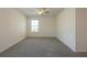 Neutral bedroom with carpet, ceiling fan, and one window at 16810 Trite Bend St, Wimauma, FL 33598