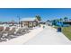 Lounge chairs on sand near a snack bar and an inflatable waterslide at 16810 Trite Bend St, Wimauma, FL 33598