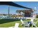 Outdoor community green space with shade and seating at 16810 Trite Bend St, Wimauma, FL 33598
