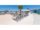 Lounge chairs on sand near a snack bar and an inflatable waterslide at 16810 Trite Bend St, Wimauma, FL 33598