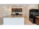 Open kitchen featuring granite countertops and stainless steel appliances at 16810 Trite Bend St, Wimauma, FL 33598