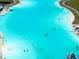 Aerial view of aqua lagoon featuring kayaking, paddle boarding, and a sandy beach at 16810 Trite Bend St, Wimauma, FL 33598