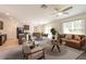 Spacious living room with open-concept design, connecting the kitchen, dining, and lounge areas at 16810 Trite Bend St, Wimauma, FL 33598