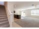 Open floorplan with a staircase, kitchen, and combined living and dining spaces at 16810 Trite Bend St, Wimauma, FL 33598