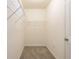 Walk-in closet featuring carpet and shelving at 16810 Trite Bend St, Wimauma, FL 33598