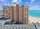 An aerial view of high-rise condos on a pristine beach overlooking the Gulf Coast at 17940 Gulf Blvd # 9B, Redington Shores, FL 33708