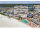 Expansive aerial view of the condominium building with a swimming pool and beach access at 17940 Gulf Blvd # 9B, Redington Shores, FL 33708