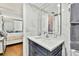 Stylish bathroom with a large mirror and a vanity, offering elegance and functionality at 17940 Gulf Blvd # 9B, Redington Shores, FL 33708