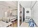 Bright bedroom with a luxurious bed frame, walkout balcony, and cozy seating area at 17940 Gulf Blvd # 9B, Redington Shores, FL 33708