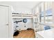 bedroom features a bunk bed, desk, and window with wooden shutters at 17940 Gulf Blvd # 9B, Redington Shores, FL 33708