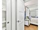 Bedroom with a glimpse of an elegant bed and nightstand, blending comfort and style at 17940 Gulf Blvd # 9B, Redington Shores, FL 33708