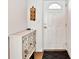 Entryway featuring a stylish cabinet and a door with a transom window at 17940 Gulf Blvd # 9B, Redington Shores, FL 33708