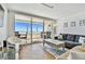Bright living room with ocean view and access to the balcony at 17940 Gulf Blvd # 9B, Redington Shores, FL 33708