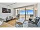 Cozy living room offering ocean views and access to the private balcony at 17940 Gulf Blvd # 9B, Redington Shores, FL 33708