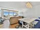 Bright living room with large windows offering panoramic ocean views and balcony access at 17940 Gulf Blvd # 9B, Redington Shores, FL 33708