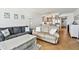 Open living space leading to a modern kitchen with stainless steel appliances at 17940 Gulf Blvd # 9B, Redington Shores, FL 33708