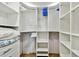 Organized walk-in closet with shelves, rods, and drawers providing ample storage space at 17940 Gulf Blvd # 9B, Redington Shores, FL 33708