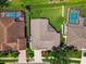Aerial view of home featuring backyard, roof, and patio at 18533 Avocet Dr, Lutz, FL 33558