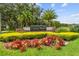 Community entrance sign surrounded by colorful landscaping at 18533 Avocet Dr, Lutz, FL 33558