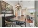 Dining area with modern table, hardwood floors, and an elegant chandelier at 18533 Avocet Dr, Lutz, FL 33558
