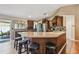 Stylish kitchen with granite countertops, stainless steel appliances, and breakfast bar seating at 18533 Avocet Dr, Lutz, FL 33558