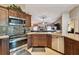 Modern kitchen features stainless appliances, granite countertops, and flows seamlessly into the living area at 18533 Avocet Dr, Lutz, FL 33558