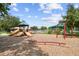 A vibrant community playground featuring multiple slides, swings, and play equipment at 18533 Avocet Dr, Lutz, FL 33558