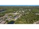 Stunning aerial view of a community featuring lush greenery, serene ponds, and well-maintained residential buildings at 18981 Duquesne Dr, Tampa, FL 33647