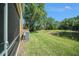 Home's backyard features a picturesque view of the pond with lush greenery at 18981 Duquesne Dr, Tampa, FL 33647
