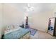 Well-lit bedroom with a vaulted ceiling, ceiling fan, and a reading nook by the window at 18981 Duquesne Dr, Tampa, FL 33647