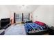 Bedroom with large windows, vaulted ceiling, a ceiling fan and home office space at 18981 Duquesne Dr, Tampa, FL 33647