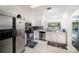 Bright kitchen featuring white cabinets, stainless steel appliances, and a breakfast nook at 18981 Duquesne Dr, Tampa, FL 33647